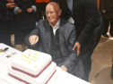 Fr Pat Kenny cutting his retirement cake