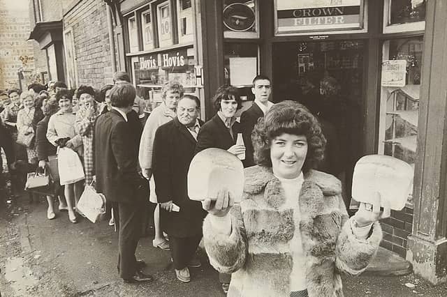 Christine Clarke of Dalkeith Street, Walsall, proudly holds aloft two hard-won loaves of bread after queuing outside Jones bakery in early December 1974. A nationwide bakers' strike triggered a wave of panic buying across the West Midlands, with hundreds of eager shoppers lining pavements for hours outside local bakeries and stores just to secure daily staples. In some towns the scramble boiled over into utter chaos, but for those patient enough to brave the December queues, walking away with fresh bread felt like striking gold. Do you remember joining the long queues during the 1974 bread strike, or recall how your family coped during the shortages?