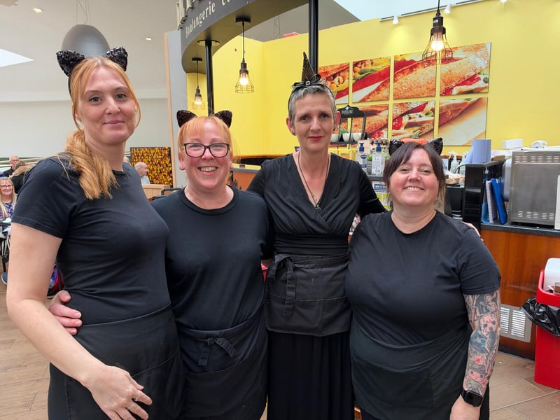 Staff dress as a witch and her familiars