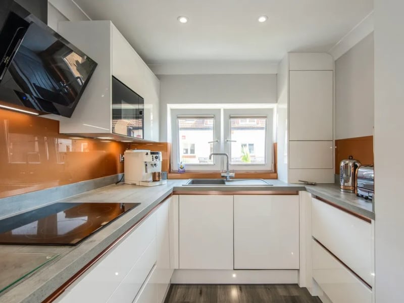Inside this three bedroom town house that overlooks the historic Hot Walls. 