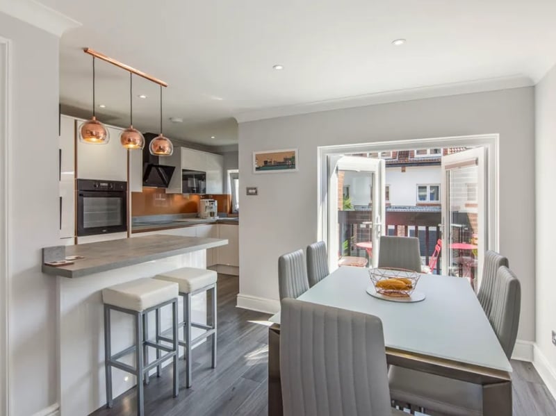Inside this three bedroom town house that overlooks the historic Hot Walls.