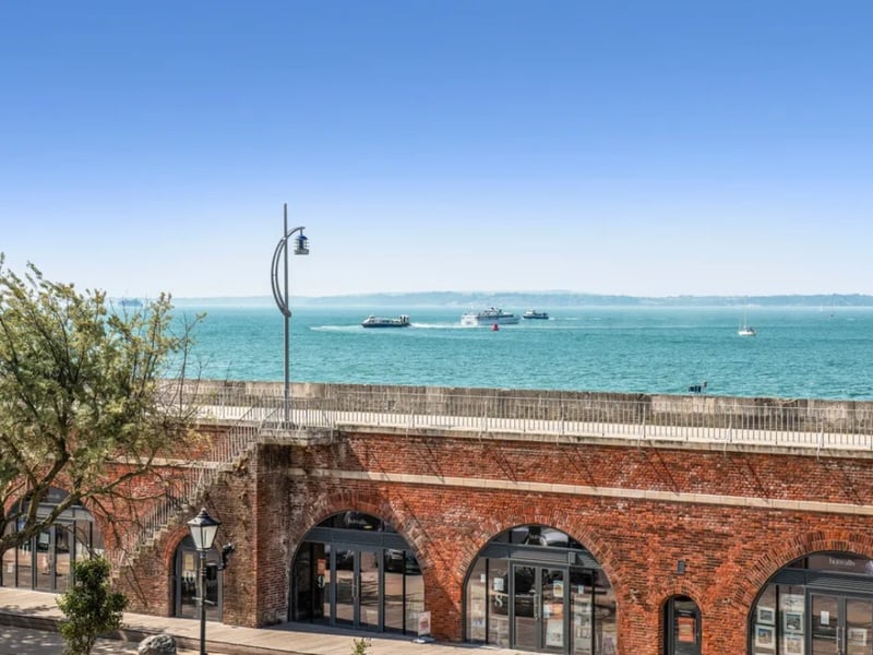 Inside this three bedroom town house that overlooks the historic Hot Walls.