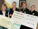 From left, are Louise Teague, assistant manager and Mae Caldwell, treasurer at Care for Cancer, alongside Brenda Caldwell, front-end colleague and Clodagh Devlin, Community Champion at Asda Omagh