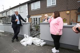 John O'Dowd, then Infrastructure Minister,  addressing flooding concerns in Ballycolman Estate, Strabane, in 2022.