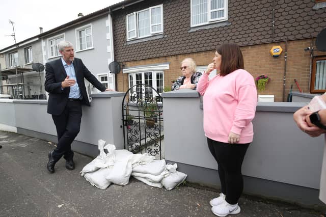 John O'Dowd, then Infrastructure Minister, addressing flooding concerns in Ballycolman Estate, Strabane, in 2022.