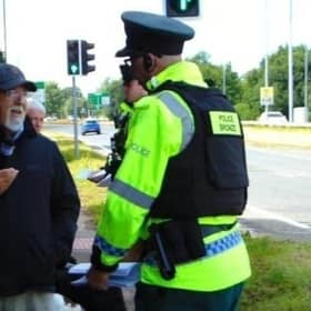 Police with retired Baptist Pastor Clive Johnston at Causeway Hospital in Coleraine on Sunday, July 7, 2024.