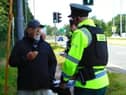 Police with retired Baptist Pastor Clive Johnston at Causeway Hospital in Coleraine on Sunday, July 7, 2024.