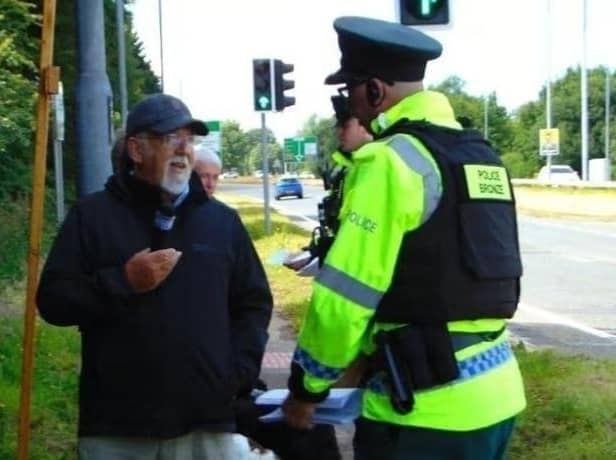 Police with retired Baptist Pastor Clive Johnston at Causeway Hospital in Coleraine on Sunday, July 7, 2024.
