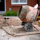 Cement mixer outside a house stock image