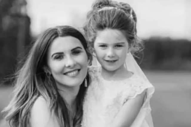 Caitlin-Rose McMullan, who died after getting off a school bus in 2025 (pictured with mother Stella).