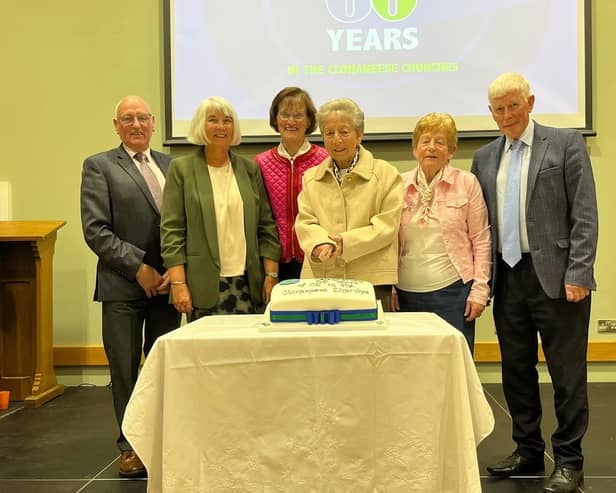 Founder members gathered around Mrs Hazel Williamson for the cake-cutting ceremony.
