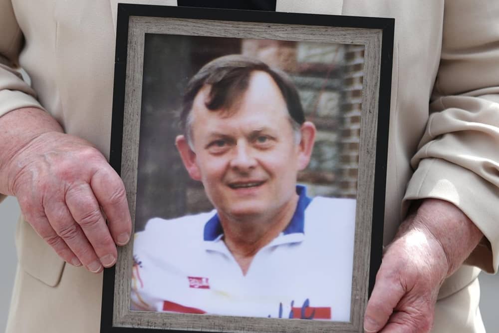 Bridie Brown, the widow of Sean Brown, holds a photograph of the murdered GAA official.